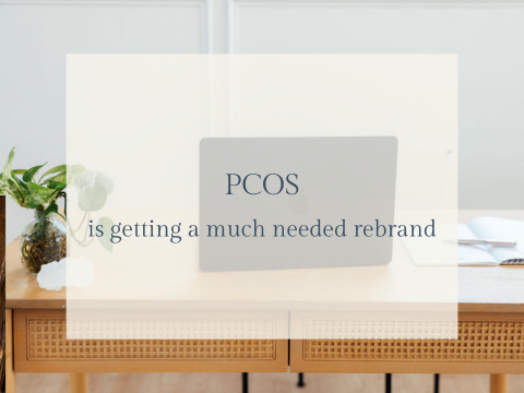 A laptop on a wooden desk with text overlay saying PCOS is getting a much needed rebrand.